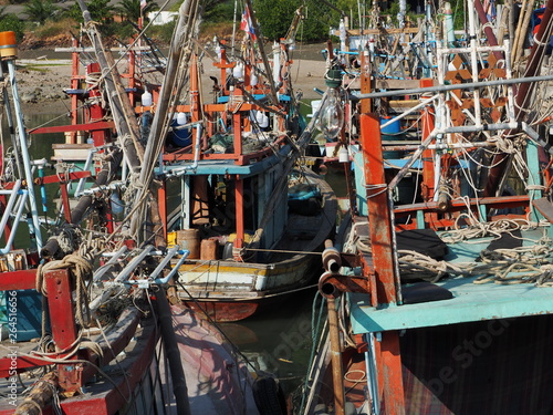 Fishing boats moored in a small port in Thailand