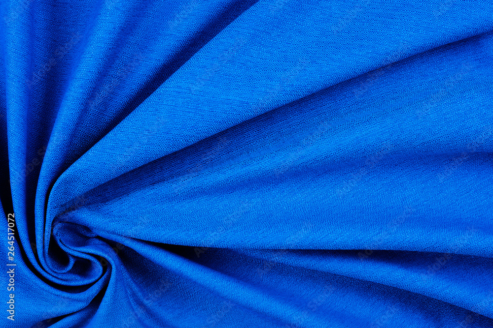 Bright blue fabric texture with folds.