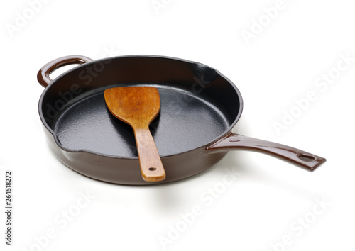 Round cast iron griddle pan on white background