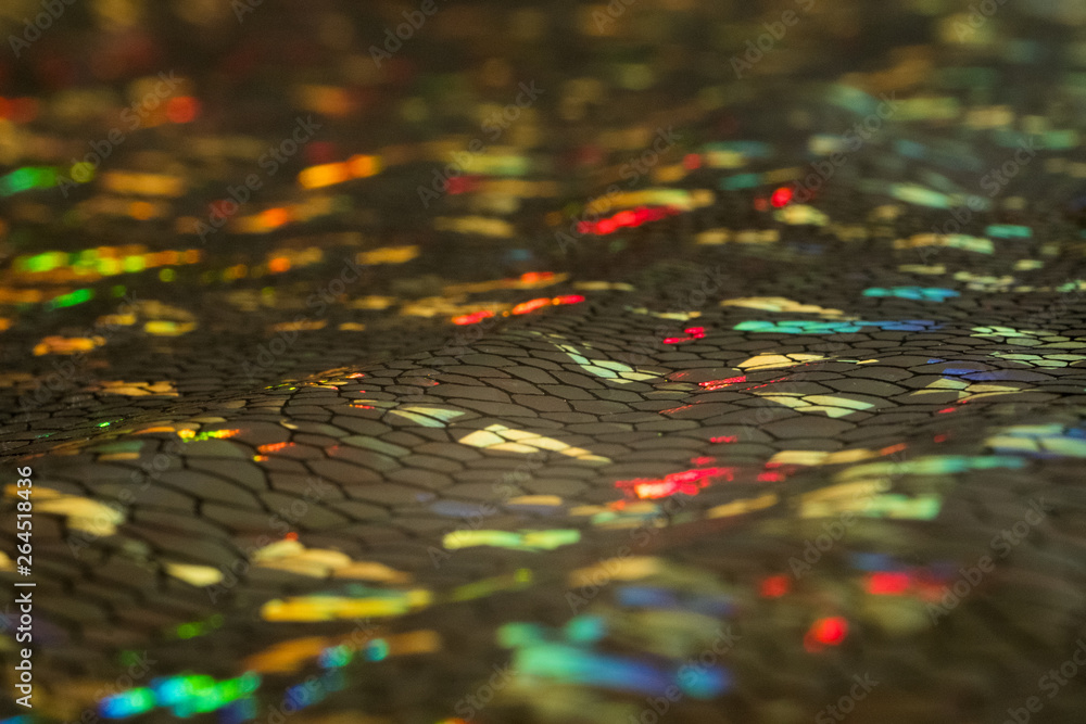 Abstract snake skin texture. Multicolor spots blurred defocused background. Abstract snake skin texture. Multicolor spots blurred defocused background.