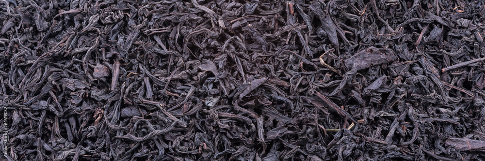Background of dried tea leaves of dark color. Macro. Background of dried tea leaves of dark color. Macro.