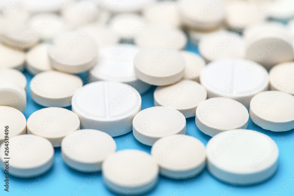 Macro photo of pills. Close-up of round white pills. Macro photo of pills. Close-up of round white pills.