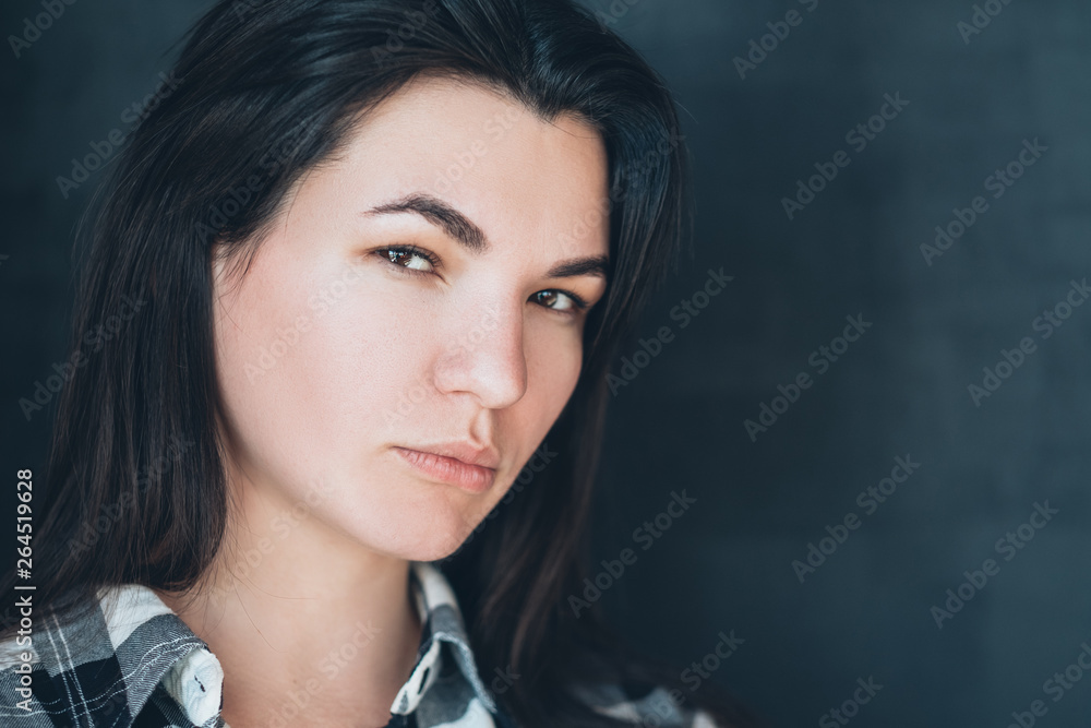Thoughtful young woman portrait. Decision making. Opinion and critical attitude. Serious facial expression. Intense look. Thoughtful young woman portrait. Decision making. Opinion and critical attitude. Serious facial expression. Intense look.