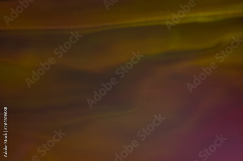 Defocused golden light waves. Blurry abstract background. Soft lens flare glow effect. © golubovy