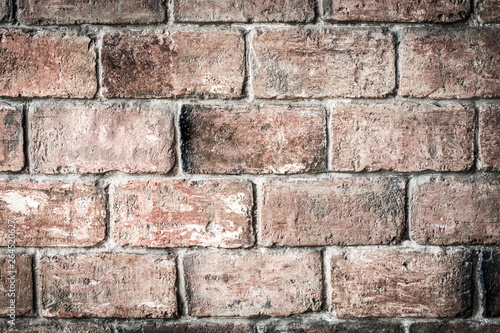 Old brick wall background. Close up of rustic brickwork of old building.