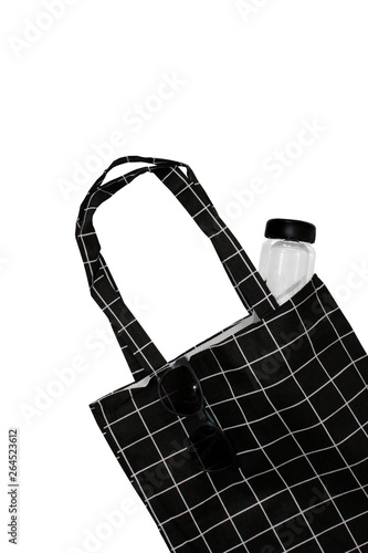 Trendy Shopping bag. Black blank cotton eco tote bag. Environmental Conservation Recycling Concept. Carrier recycle grocery bag. Black cotton bag isolated on white background.Plastic free items. 