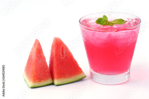 Watermelon juice with mint in glass and slice watermelon isolated on white background