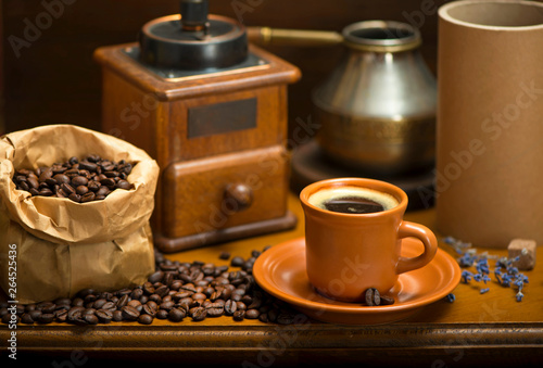 cup of coffee, turka, coffee beans and a coffee grinder, croissants