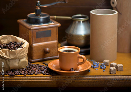 cup of coffee, turka, coffee beans and a coffee grinder, croissants