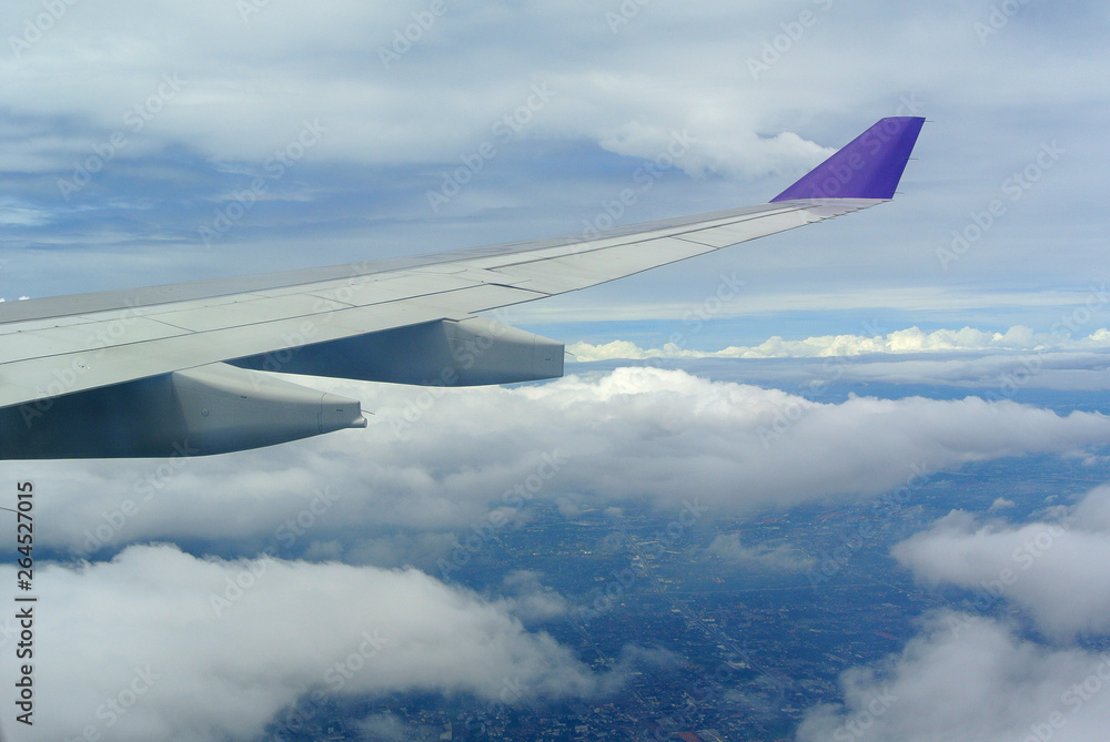 Aerial view Clouds and sky as seen through window of an aircraft Aerial view Clouds and sky as seen through window of an aircraft