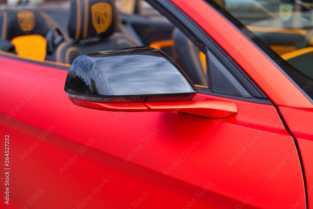 The image Red car side mirror