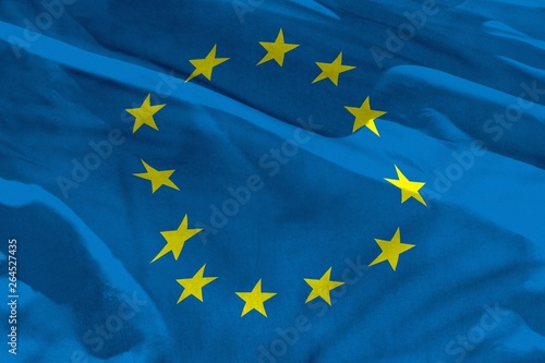 Waving European Union flag for using as texture or background, the flag is fluttering on the wind