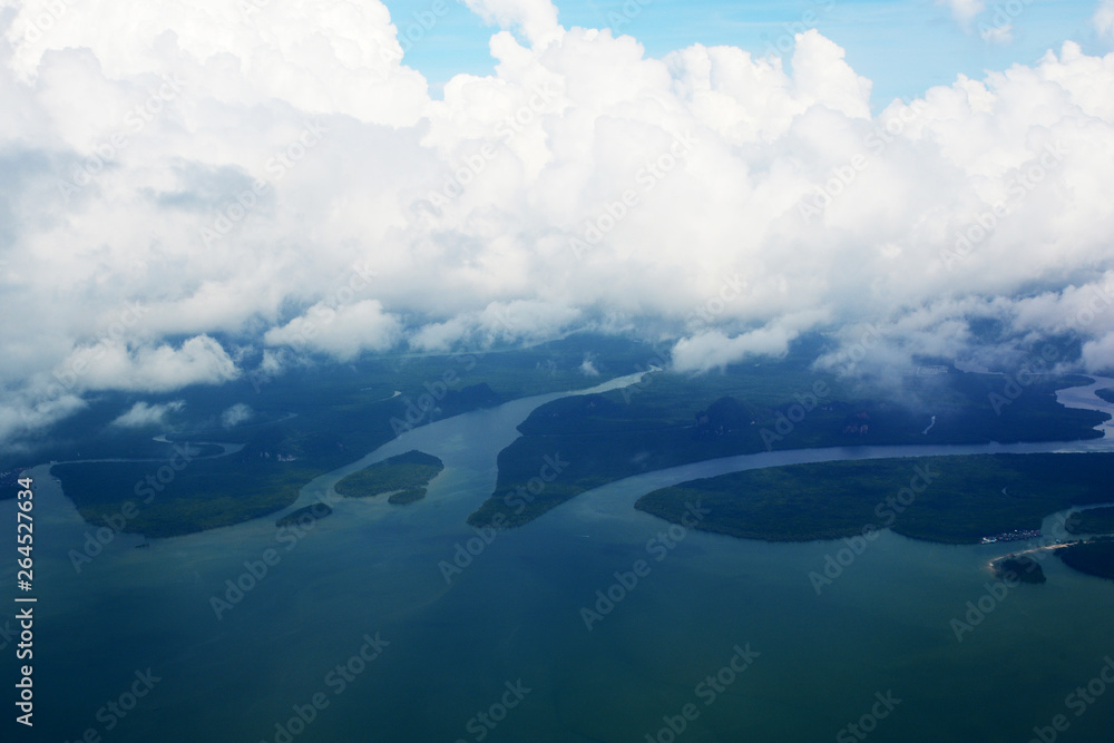 Fototapeta premium Tropical group of islands in Thailand as seen on window through window of an aicraft. Top view