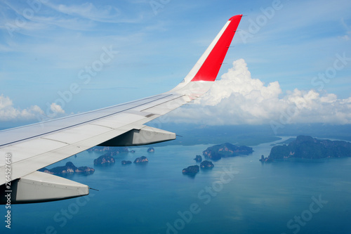 Tropical group of islands in Thailand as seen on window through window of an aicraft. Top view