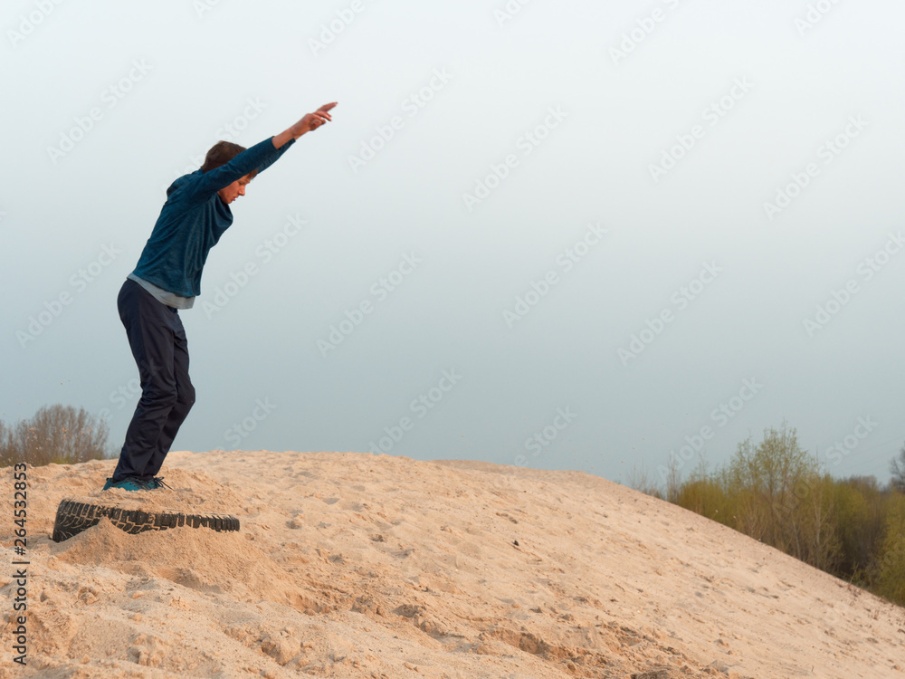 Children and teenagers have fun on the white sand. parkour Children and teenagers have fun on the white sand. parkour