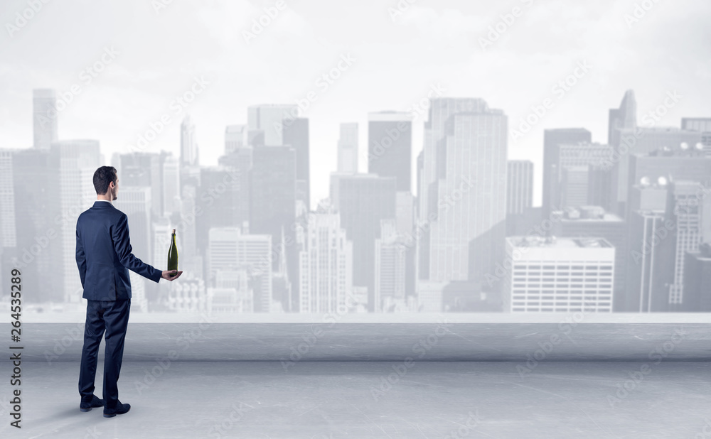 Businessman standing with his back on a roof with objects in his hand
Businessman standing with his back on a roof with objects in his hand