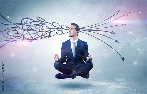 Businessman levitates in yoga position and systematize with thinking concept 