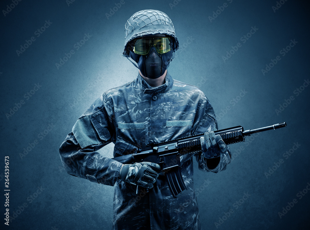 Soldier agent in a dark room with arms on his hand and gas mask
Soldier agent in a dark room with arms on his hand and gas mask