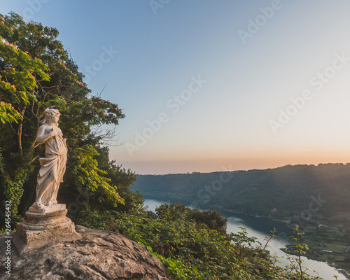 Принти на полотні View of Lake Nemi and hills with statue on rock, from Nemi, Italy