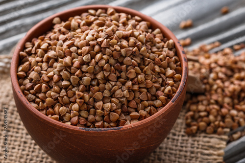 Grain buckwheat on a gray wooden background