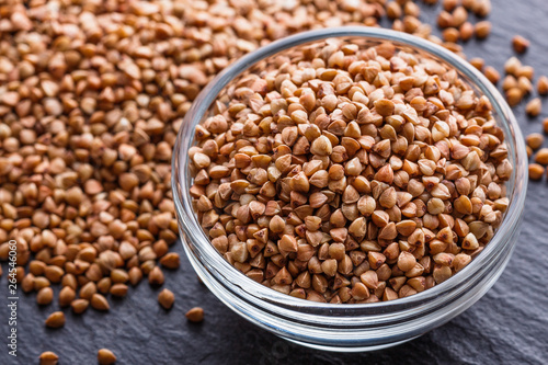 Grain buckwheat on a dark stone background