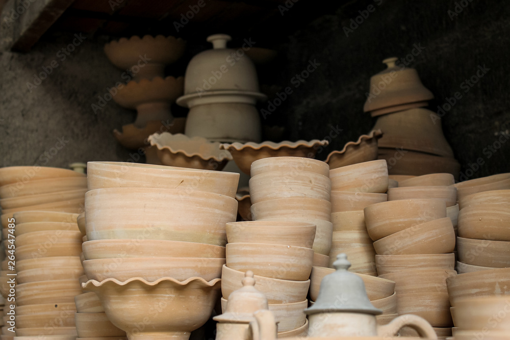 FEZ, MOROCCO - November 1, 2012: Handmade pottery goods stacked in columns in a pottery workshop in Fez, Morocco. FEZ, MOROCCO - November 1, 2012: Handmade pottery goods stacked in columns in a pottery workshop in Fez, Morocco.