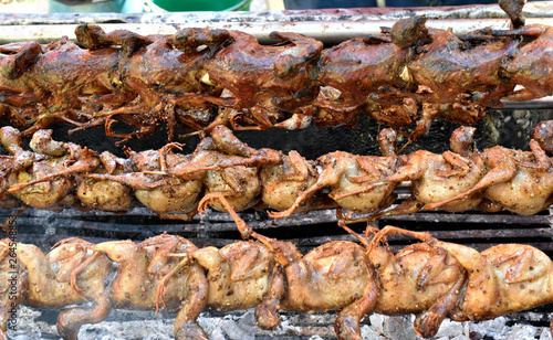 Many quail grilled on the grill