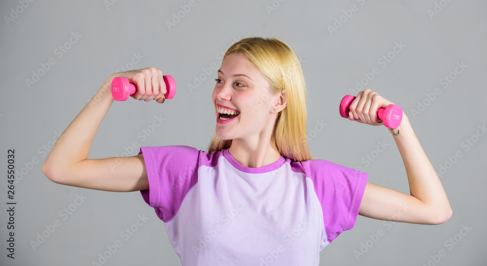 Healthy lifestyle concept. Woman fitness coach exercising with dumbbells. Easy exercises with dumbbells. Workout with dumbbells. Biceps exercises for female. Girl hold dumbbells. Fitness instructor Healthy lifestyle concept. Woman fitness coach exercising with dumbbells. Easy exercises with dumbbells. Workout with dumbbells. Biceps exercises for female. Girl hold dumbbells. Fitness instructor