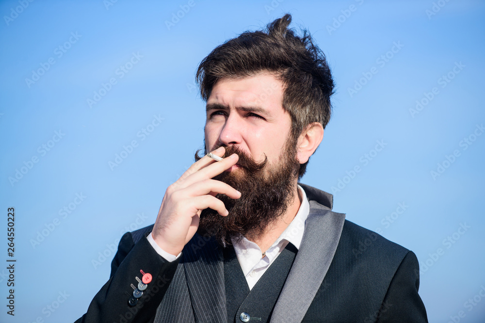 handsome and bossy. Future success. Male formal fashion. Businessman against the sky. brutal caucasian hipster with moustache. Mature hipster with beard. Bearded man smoking cigarette. smoke handsome and bossy. Future success. Male formal fashion. Businessman against the sky. brutal caucasian hipster with moustache. Mature hipster with beard. Bearded man smoking cigarette. smoke