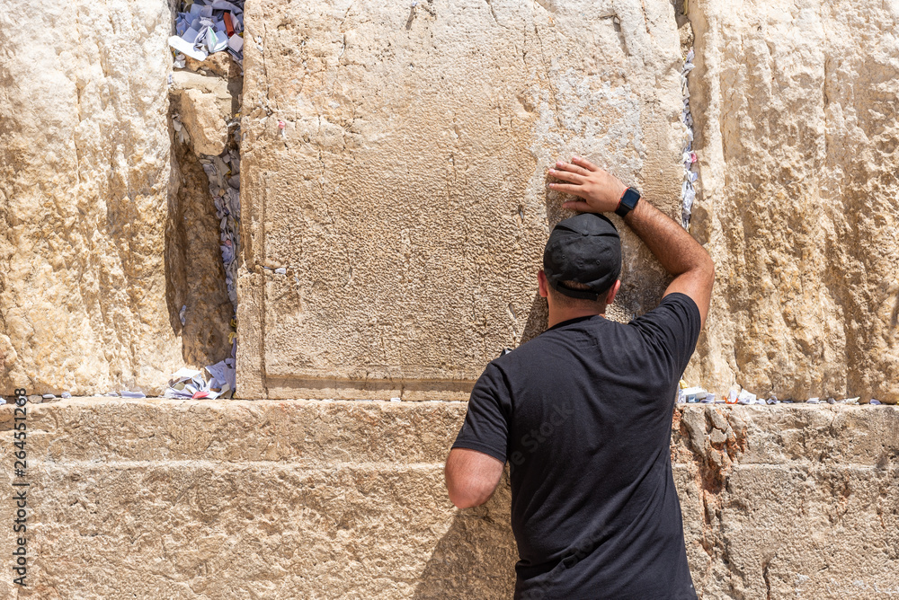 Man praying at the western wall, Jerusalem, Israel Man praying at the western wall, Jerusalem, Israel