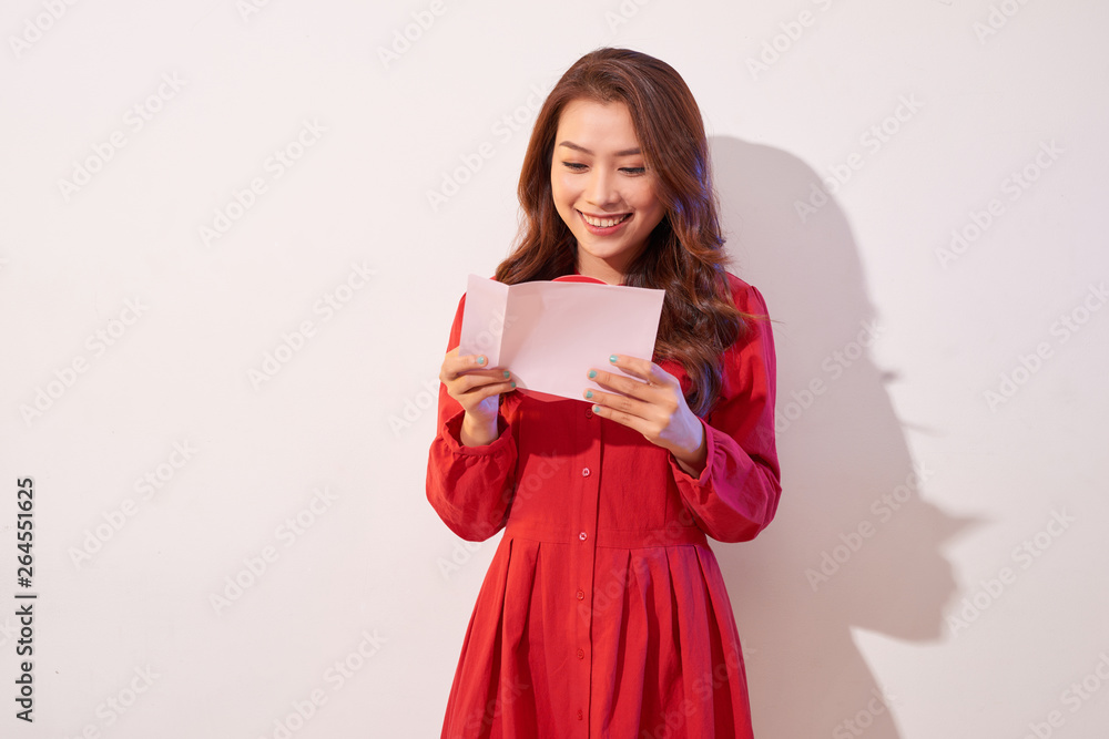 Lovely female with red heart isolated on gray background, celebration of Valentine day, romantic feelings, harmony and love concept Lovely female with red heart isolated on gray background, celebration of Valentine day, romantic feelings, harmony and love concept