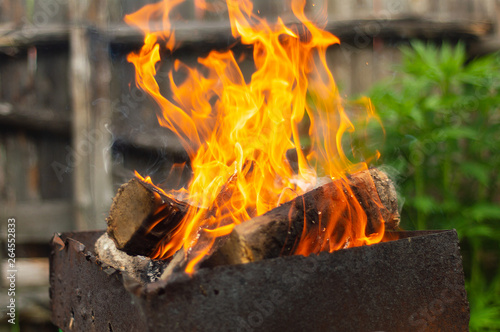 the wood in the brazier, burning a fiery red