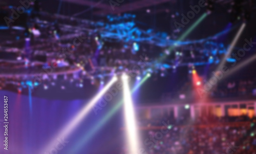 Blurred Concert light with colored spotlights and smoke. © zilvergolf