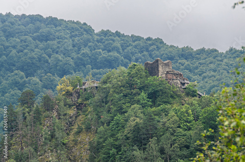 Poenari Castle, known as Poenari Citadel, green mountains.