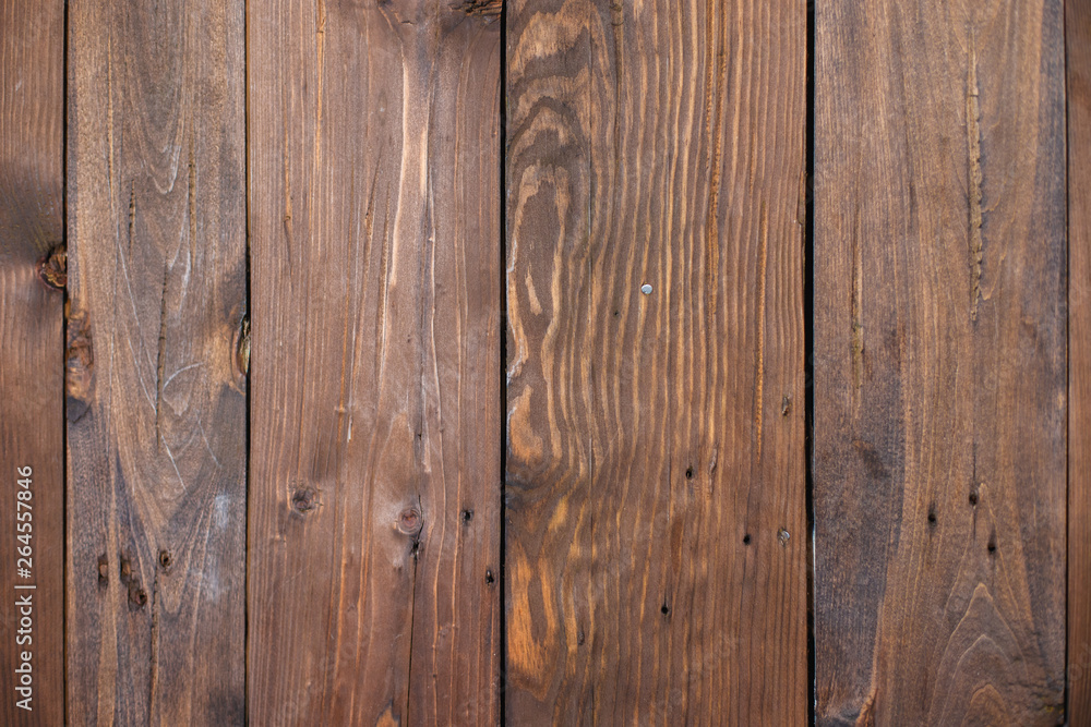 Naklejka premium Background of brown boards, nailed together with nails.