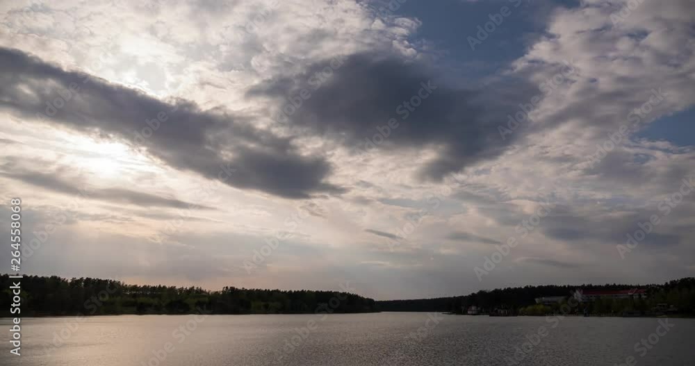 Clouds at sunset evening time by the lake. Timelapse Clouds at sunset evening time by the lake. Timelapse
