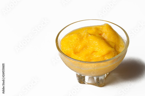 Grinded orange in bowl isolated on a white background.Fruit