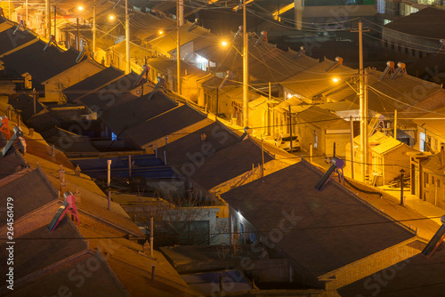 Traditional residential buildings and alleys at night， in China.