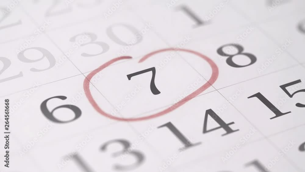 Marking the seventh 7 day of a month in the calendar with a red marker Marking the seventh 7 day of a month in the calendar with a red marker
