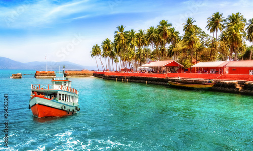 Tourist boat near Ross island sea beach Andaman India with scenic landscape with view of tourist speed boat photo