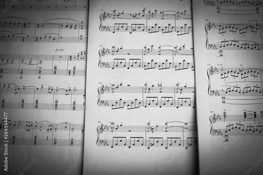 Naklejka premium music notes and sheets background