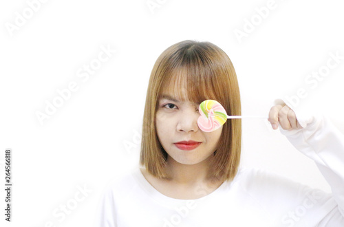easterner girl eating colourful lollipop.