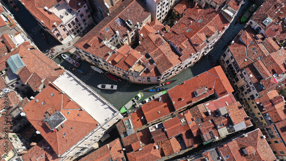 Aerial top view photo of canal in city of Venice with unique architecture, Italy