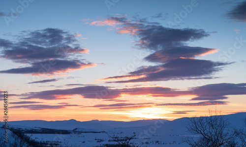 Cloudy sunset over Swedish Lapland on a winters day. Ahkka, Sweden.
