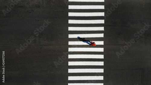 Canvastavla One pedestrian crossing zebra crosswalk, aerial, top view