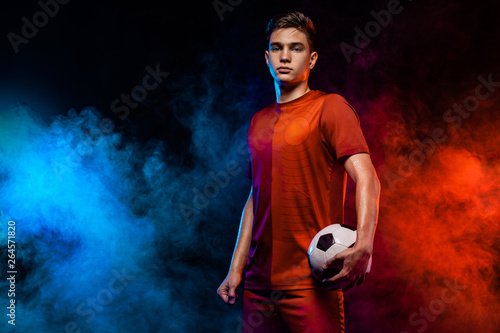 Teenager - soccer player Fototapet