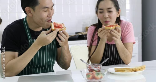 Wallpaper Mural Close up scene video of lovely Asian couple feeding bread that spread by strawberry jam for each other. Torontodigital.ca