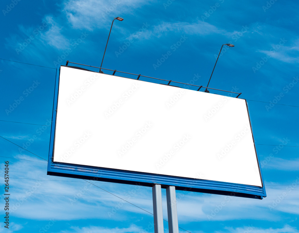 Billboard on the background of a beautiful blue cloudy sky. Mock up for your advertising or announcements Billboard on the background of a beautiful blue cloudy sky. Mock up for your advertising or announcements