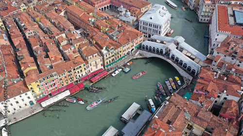 Aerial drone photo of iconic and unique Ponte Rialto or Rialto bridge crossing Grand Canal, Venice, Italy