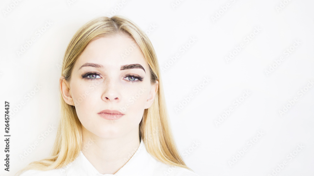 Blonde girl in a beauty salon. Making eyebrows with henna, before and after. Safe face care Blonde girl in a beauty salon. Making eyebrows with henna, before and after. Safe face care